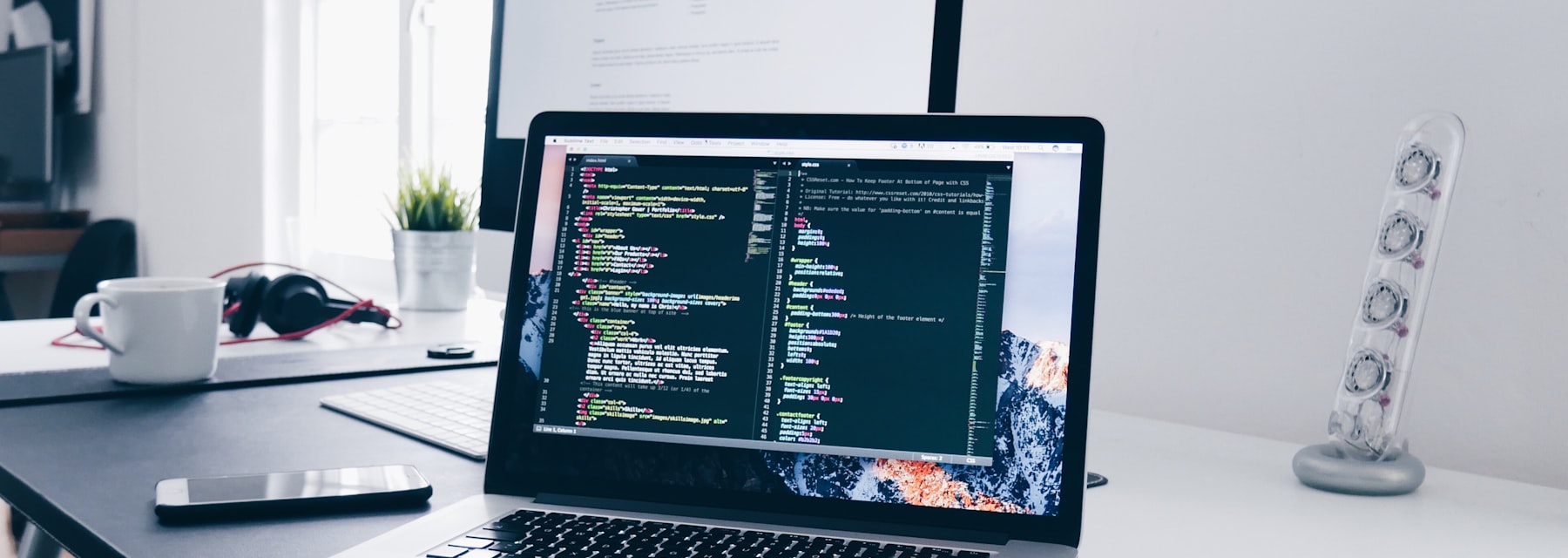 Developer workspace with code on screen